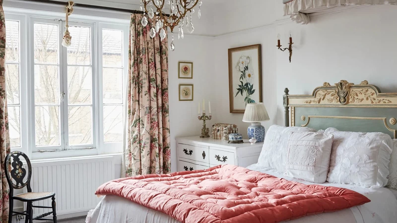 Level, well-lit bedroom photo showing windows, floor, bed, furniture, and fixed architecture