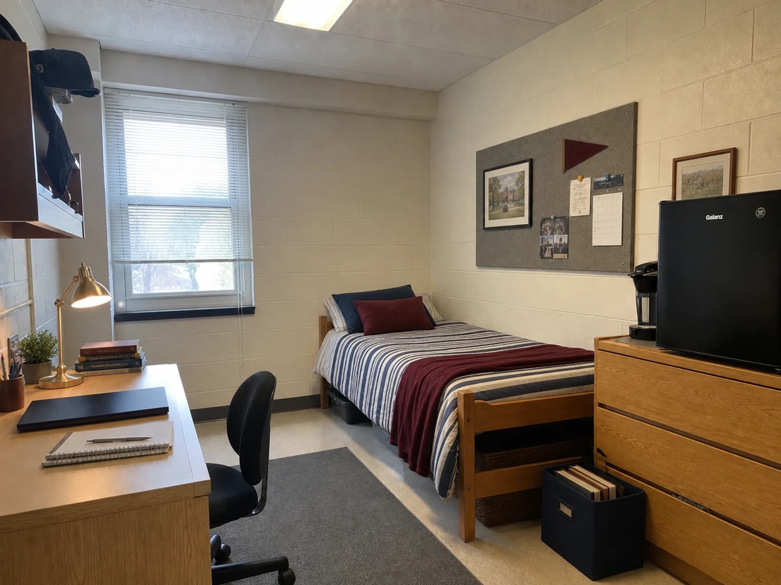 Classic Preppy editorial version of the same dorm with navy striped bedding, burgundy accents, and brass tone task lighting